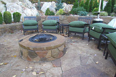 round cobblestone fire pit for the backyard